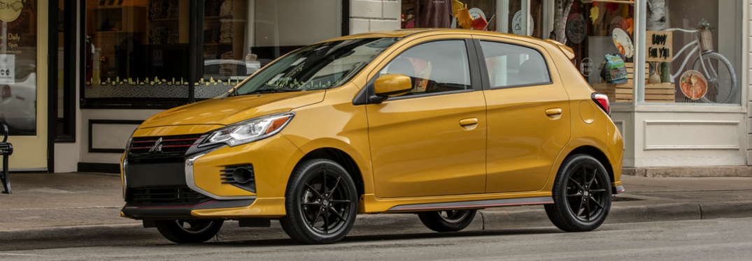 2023 Mitsubishi Mirage in Sand Yellow Parked on City Street