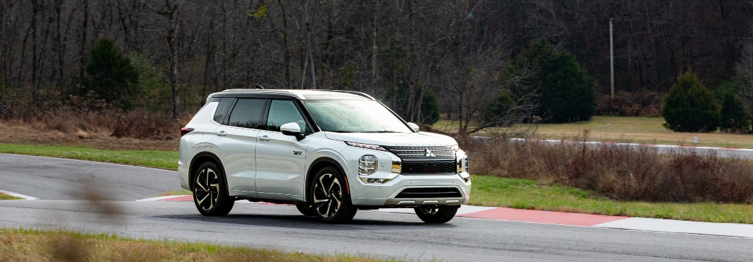 White 2023 Mitsubishi Outlander PHEV Driving